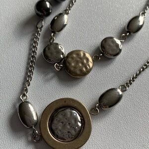 Super long silver and gold necklace. Can be doubled up.